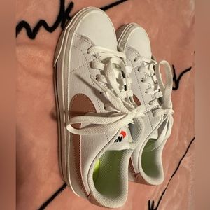 Nike court one shoes.